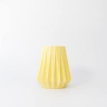 Buddy pet urn. Image of folded origami urn in lemon.