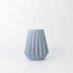 Buddy pet urn. Image of folded origami urn in ocean.
