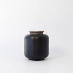 Buddy pet urn. Image of textured traditional urn in black.