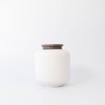 Buddy pet urn. Image of textured traditional urn in white.